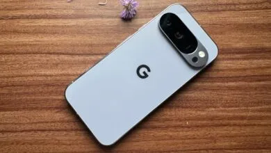 Back of a light gray Google Pixel phone with a prominent camera bar.