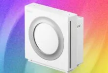 Coway Airmega Mighty air purifier, white, against a colorful background.