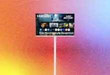 Samsung Movingstyle Essential TV on a stand against a colorful gradient background.