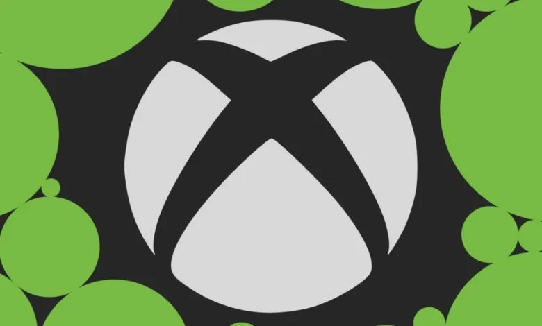 Xbox logo in white with green circles on a dark gray background.