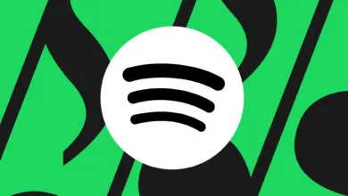 Spotify logo on green musical note background.