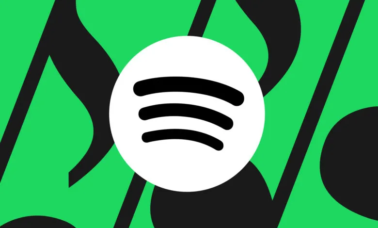 Spotify logo on green musical note background.