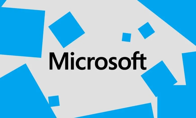 Microsoft logo with blue squares on a light gray background.