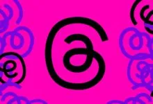Abstract design with black and purple swirls on a bright pink background.
