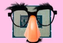 CPU chip wearing Groucho Marx glasses and nose on pink background.