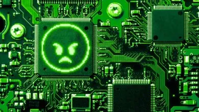 Green circuit board with an angry pixelated face on a chip.
