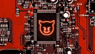 Close-up of a red circuit board with a glowing devil icon on the central chip.