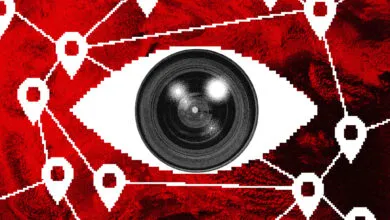 Camera lens eye surrounded by location pins and network lines.