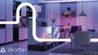 Modern living space with kitchen, dining area, and lounge bathed in purple and blue light.