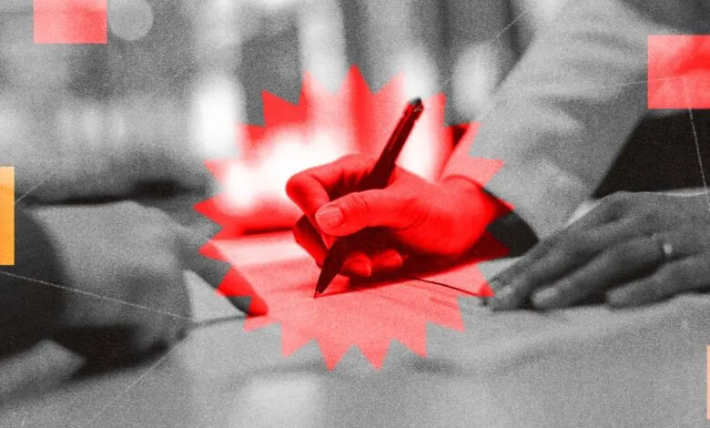 Hand signing a document with a pen, stylized in red and grayscale.