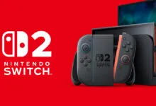 Nintendo Switch 2 console and controllers on a red background.