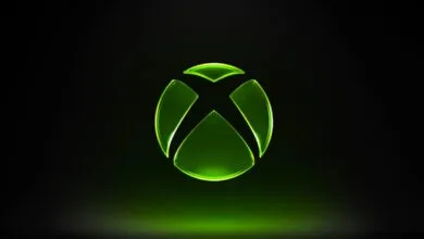 Glowing green Xbox logo on a black background.