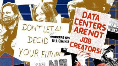 Protesters holding signs about AI, data centers, and workers' rights.
