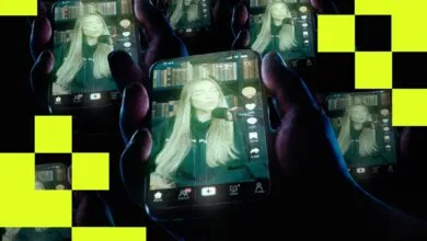 Multiple hands holding phones displaying a woman on TikTok.