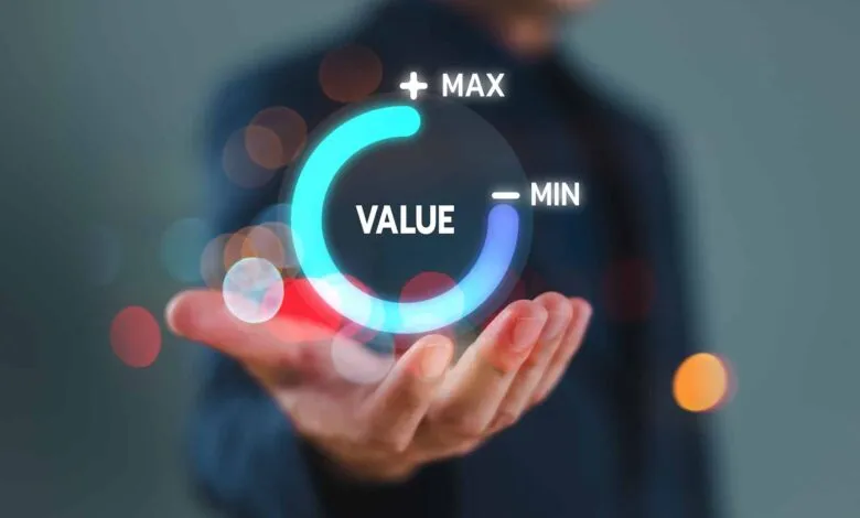 Hand holding a glowing circle with 'VALUE' inside, marked 'MAX' and 'MIN'.