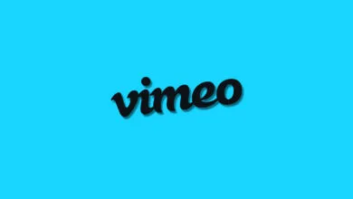Vimeo logo in black with shadow on a bright blue background.