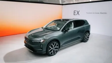 Gray Volvo EX60 electric SUV on display with modern interior.