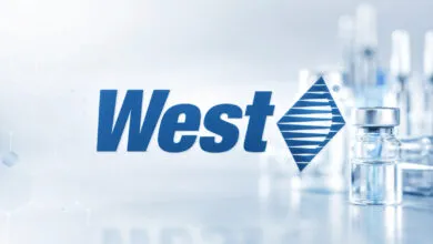 West Pharmaceutical Services logo with vials in the background.