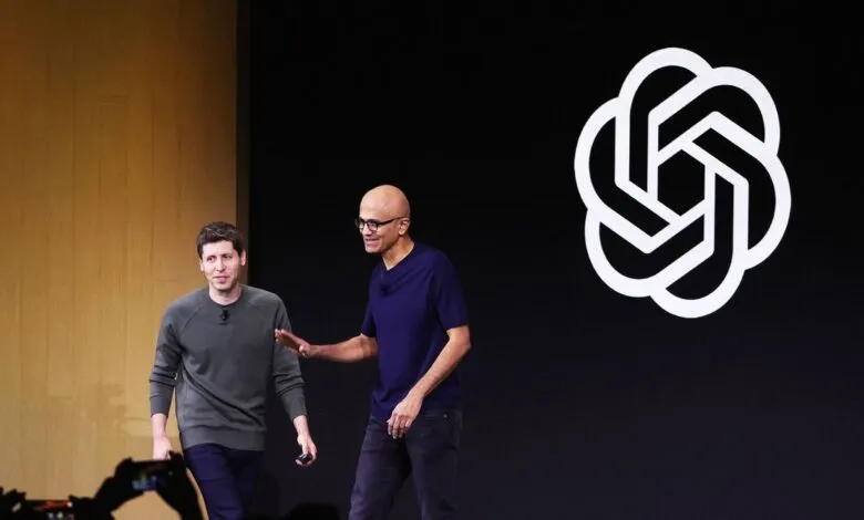 Greg Brockman and Satya Nadella on stage with OpenAI logo.