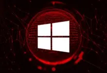 White Windows logo on a red digital network background.