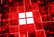 Red Windows logo on circuit board tiles, glowing effect.
