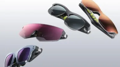 Four pairs of XREAL Beam glasses with different lens colors floating in air.