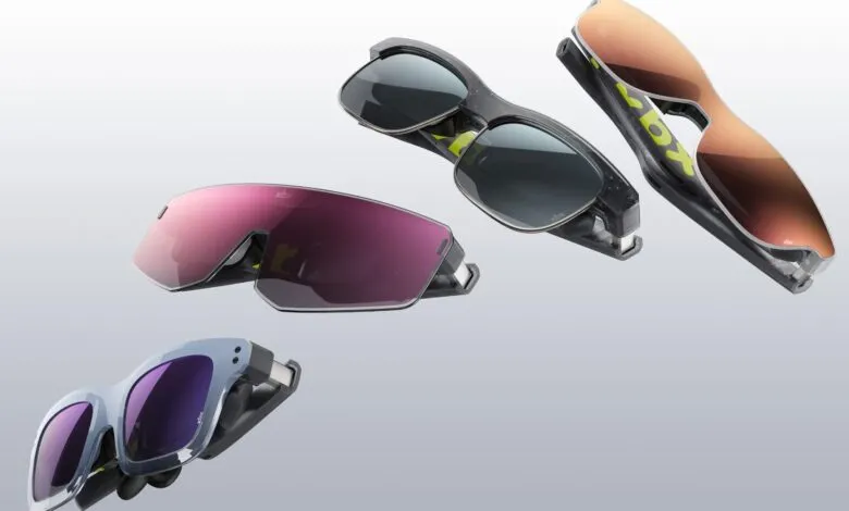 Four pairs of XREAL Beam glasses with different lens colors floating in air.