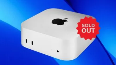 Apple Mac Mini computer with a 'Sold Out' sticker on a blue background.