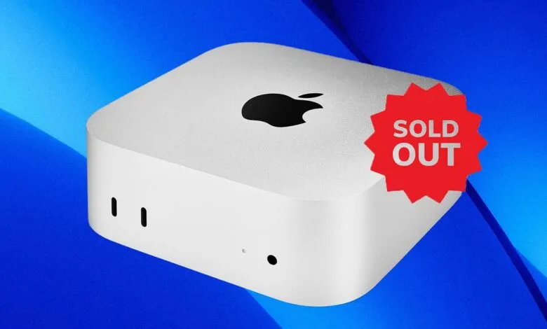 Apple Mac Mini computer with a 'Sold Out' sticker on a blue background.