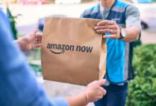 Amazon Now delivery being handed to customer at their door.