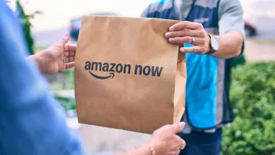 Amazon Now delivery being handed to customer at their door.