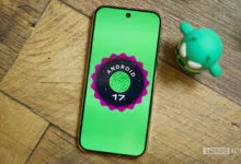 Android 17 logo on a phone screen with Android mascot.