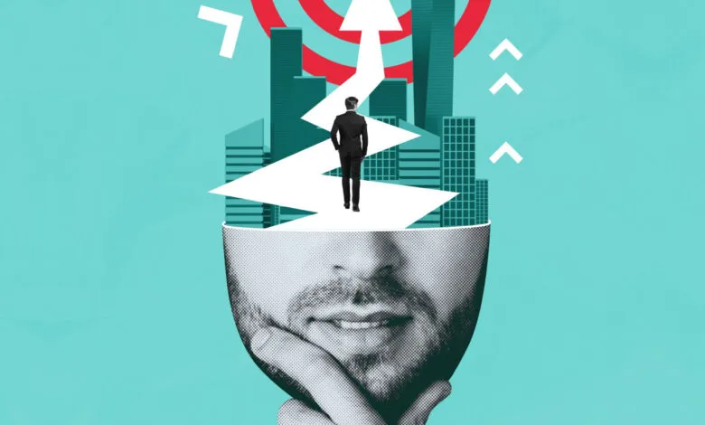 Conceptual image of a man walking a path from a head to a target.