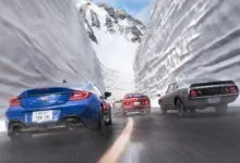 Four cars speed through a snowy mountain pass, creating a sense of motion.