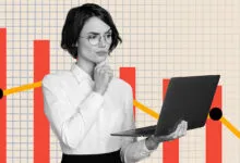 Woman with laptop looks thoughtfully at a declining financial graph.