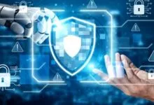 Robot and human hands interact with a digital shield, representing cybersecurity.