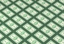 Isometric pattern of stylized green $100 bills on a green background.