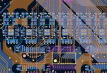 Detailed view of a complex, colorful printed circuit board design.