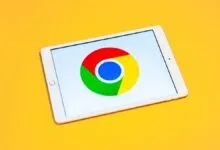 Tablet displaying the Google Chrome logo on a bright yellow background.