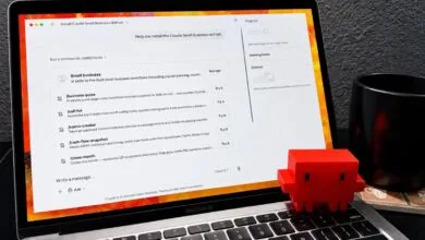 Laptop displaying Claude AI business skills with a red toy figure.
