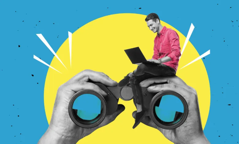 Person sits on binoculars using laptop, against yellow and blue background.