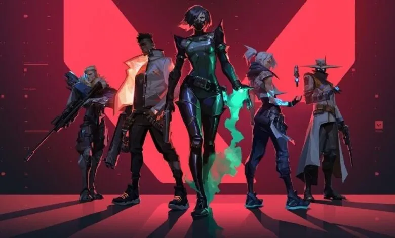 Valorant characters stand ready in front of a red backdrop.