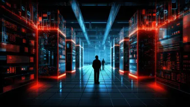 Two silhouetted figures walk through a futuristic server room with glowing lights.