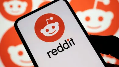 Reddit logo and Snoo mascot displayed on a smartphone screen.
