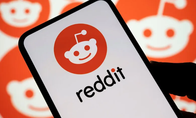 Reddit logo and Snoo mascot displayed on a smartphone screen.
