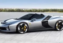 Sleek silver Ferrari HC25 roadster with black accents and yellow brake calipers.