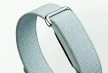 Close-up of a light blue woven Fitbit band with a silver buckle.