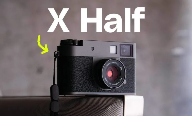 Fujifilm X Half camera with strap, gray body, and Fujinon lens.