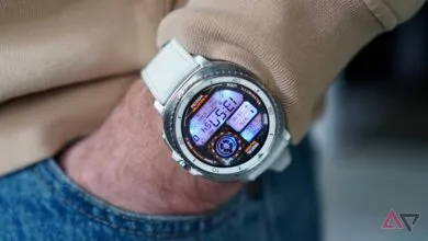 Close-up of a smartwatch with a white band on a person's wrist.