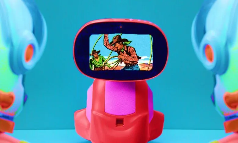 Toy robot with a screen showing a vintage cowboy cartoon scene.